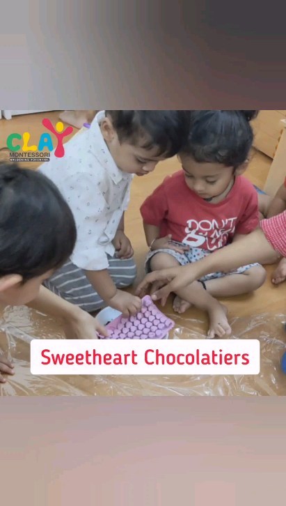 Love is in the air at Clay Montessori this Valentine's Day! Our children had a blast making heart-shaped chocolates and sharing the love with each other. We're so proud of our little chocolate makers! 🍫❤️
Benefits of making chocolate with your child :
Encourages creativity: Making heart-shaped chocolates provides an opportunity for children to use their imaginations and create something unique.
Develops fine motor skills: Pouring and shaping melted chocolate helps to develop children's hand-eye coordination and fine motor skills.
Promotes social skills: Taking turns with the heart-shaped trays and working together on the activity can help children develop important social skills like sharing and cooperation.
Provides a sensory experience: The texture and aroma of melted chocolate can be a fun and engaging sensory experience for young children.
Builds self-esteem: Successfully creating their own heart-shaped chocolates can give children a sense of accomplishment and boost their self-esteem.
Encourages learning: The activity can also be used as an opportunity to introduce children to basic math concepts like measuring ingredients and counting out chocolates

#claymontessori #montessori #mumbai #Matunga #sion #parel #Dadar #Wadala #earlychildhoodeducation #earlylearning #earlychildhood #earlyyearseducation #preschools #chocolate #chocolatemaking #toddlers #toddlerscooking #toddlersofinstagram #toddlerslife #momblogger #mominfluencer #mumbaimomblogger #numbaimoms #mumbaimominfluencer