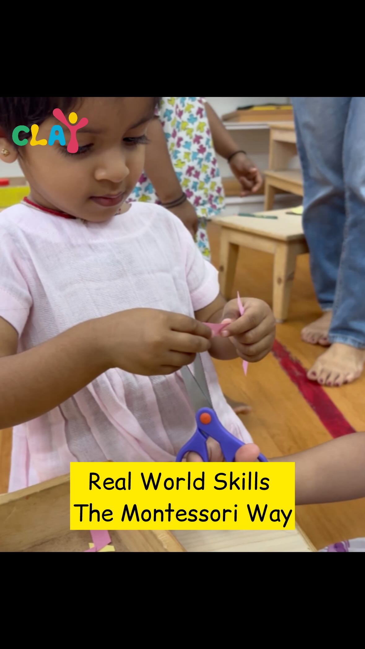 Collaboration & Social Development – One child holds, the other cuts, fostering teamwork and patience.

Concentration & Focus – Engaging deeply in a purposeful task.

Fine & Gross Motor Skills – Strengthening hands for writing and refining hand-eye coordination.

Real-World Learning – Practical life skills through hands-on experience.  #claymontessori #montessori #collaboration #collaberativelearning #montessoripreschool #finemotorskills #mumbai #matunga #dadar #wadala #parel #sewree #sion. [collaborative work in toddlers, toddlers collaboration, fine motor skills, concentration, focus in toddlers]